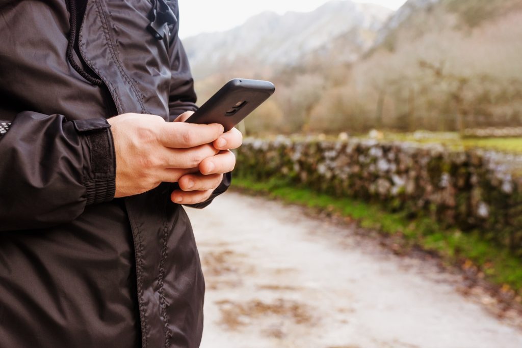 Person consulting maps by gps